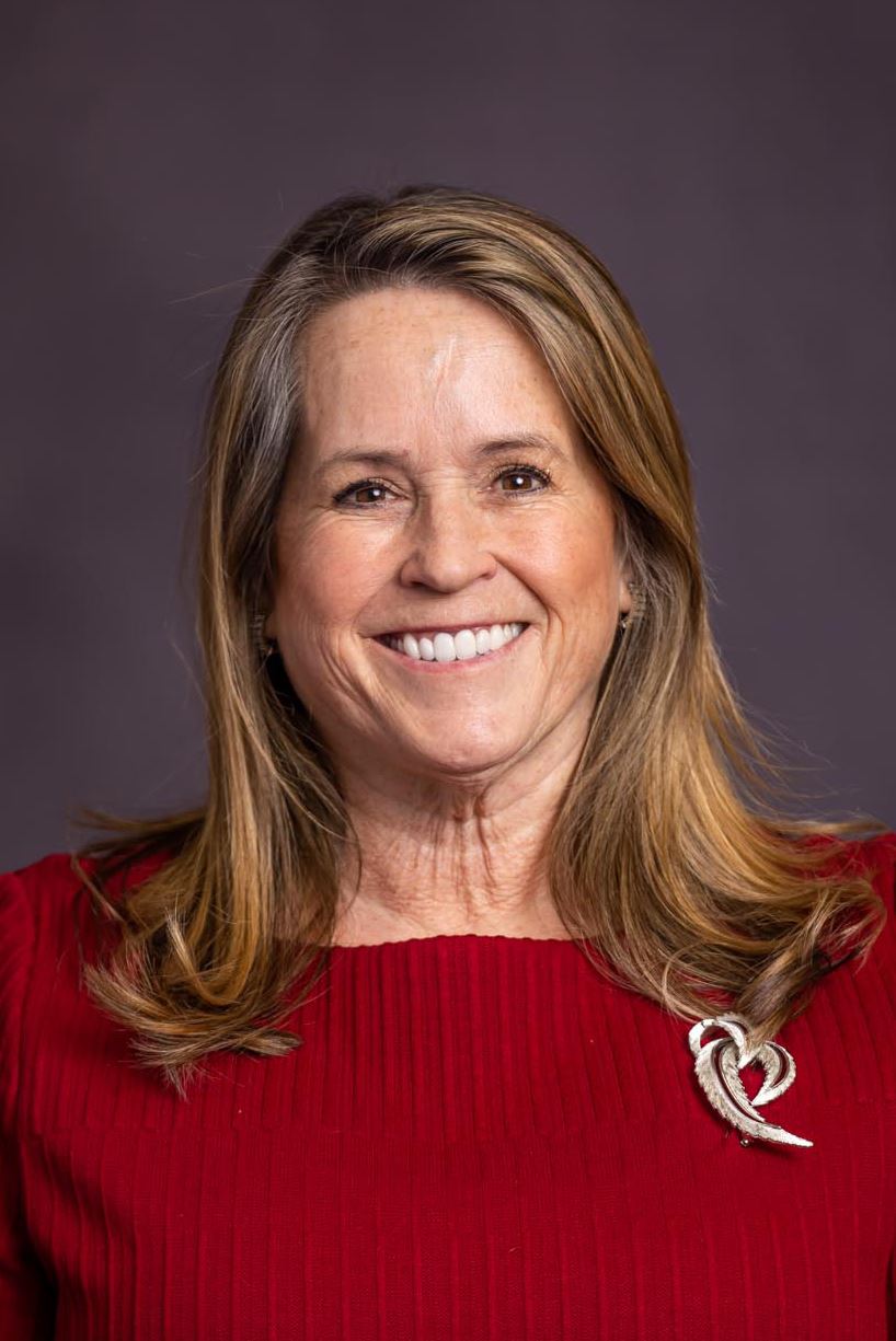 A woman smiling for the camera.