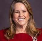 A woman smiling for the camera.