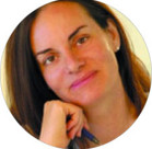 A woman with her hand on her chin.