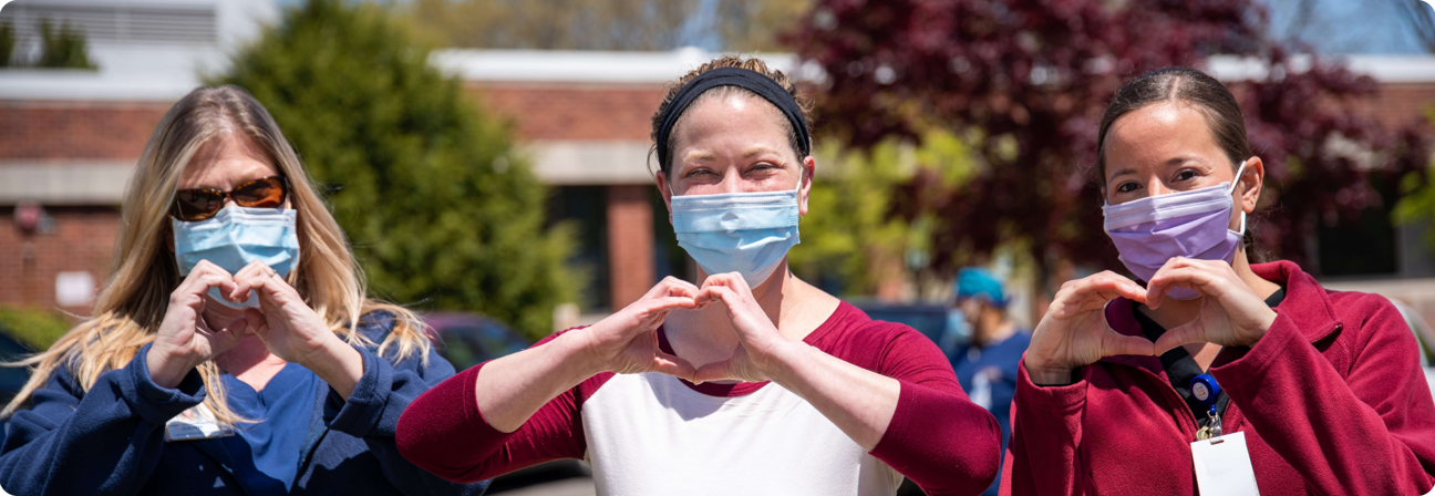 A group of women holding up their glasses.