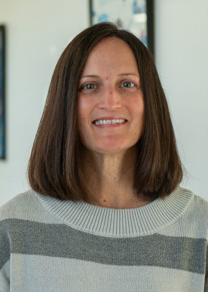A woman smiling for the camera.