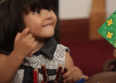 A girl holding a flag.