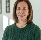 A woman smiling for the camera.