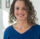 A person with curly hair.