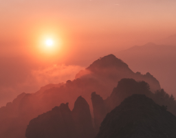 A sunset over a mountain range.