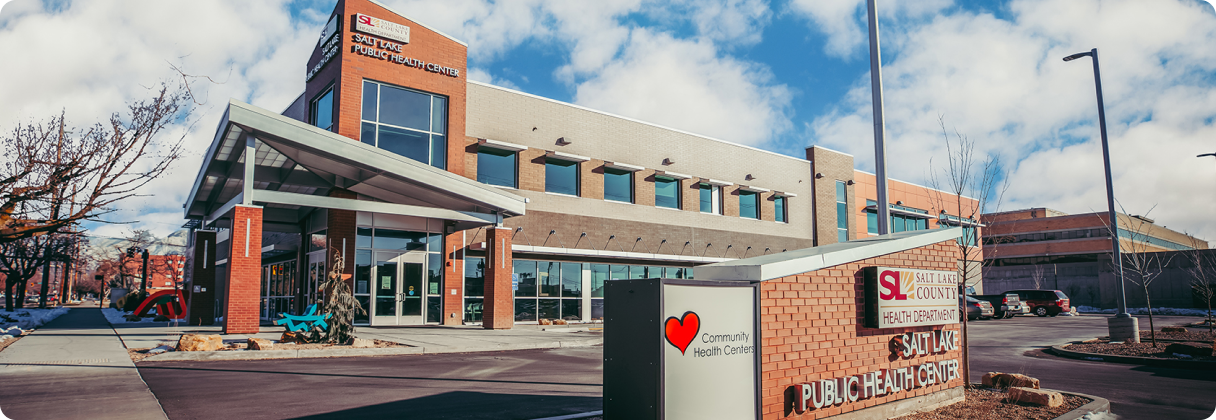 A building with a sign in front.