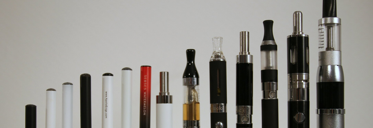 A group of different colored lipsticks.