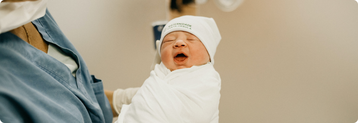 A baby in a white robe.