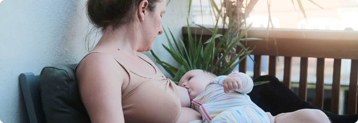 A woman holding a baby.