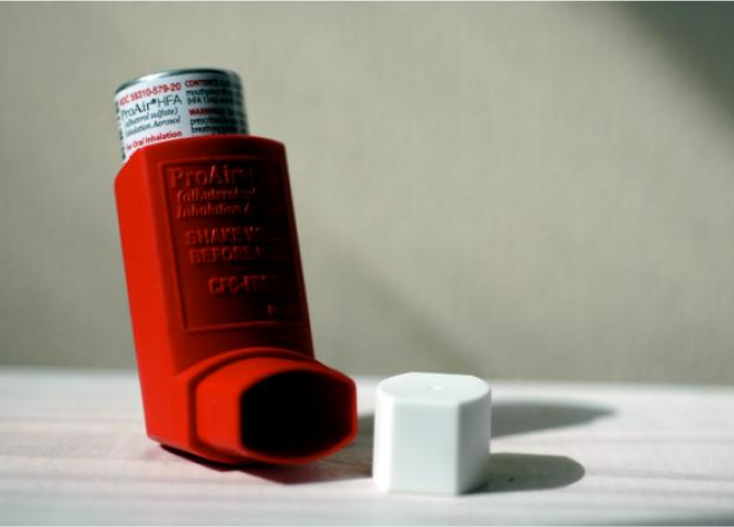 A bottle of red liquid.