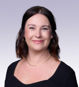 A woman wearing a black dress.