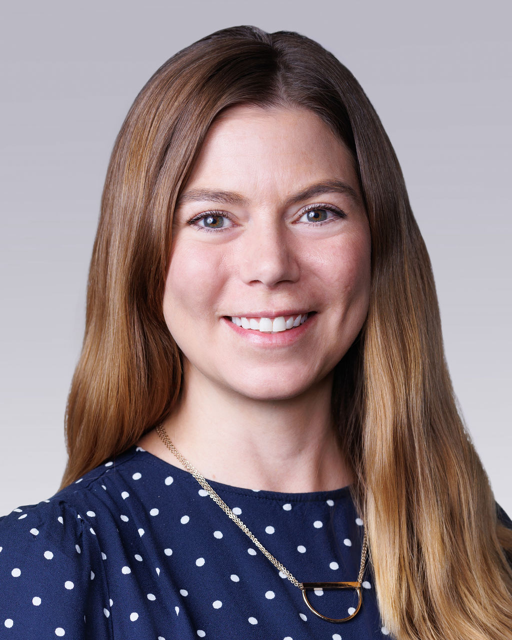 A woman smiling for the camera.