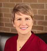 A person smiling for the camera.