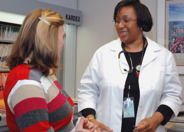 A doctor talking to a patient.