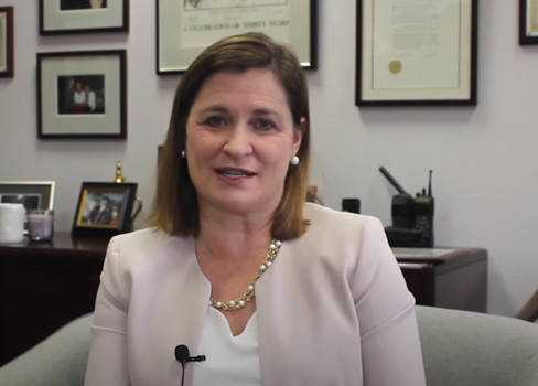 Jenny Wilson sitting in a chair.