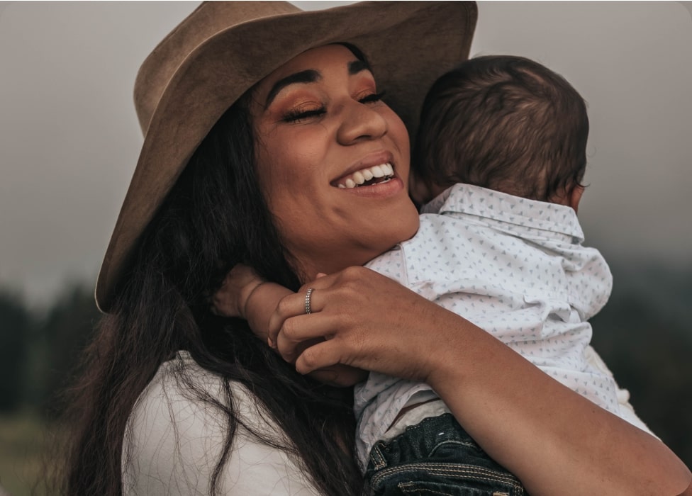 A person holding a baby.