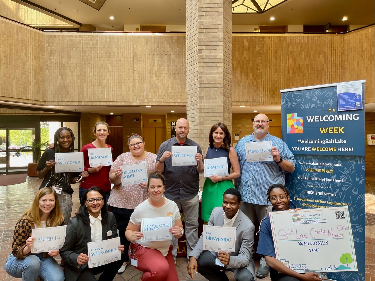 David Gergen et al. holding signs.