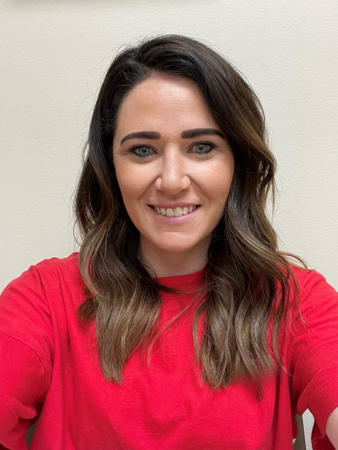 A woman smiling for the camera.