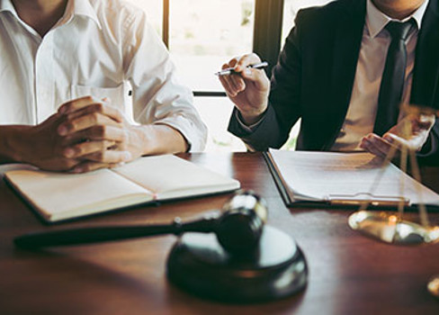 A few people sitting at a table.