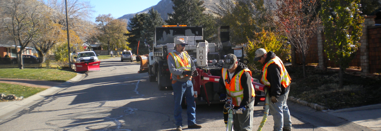 A group of men working on a road.