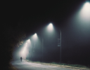 A person walking in a dark area.
