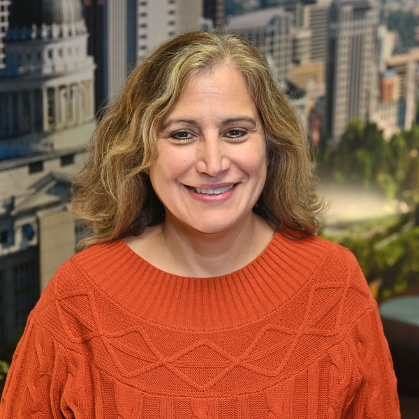 A woman smiling for the camera.