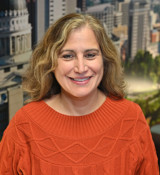 A woman smiling for the camera.