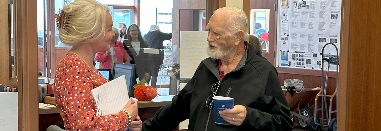 A man and a woman talking.