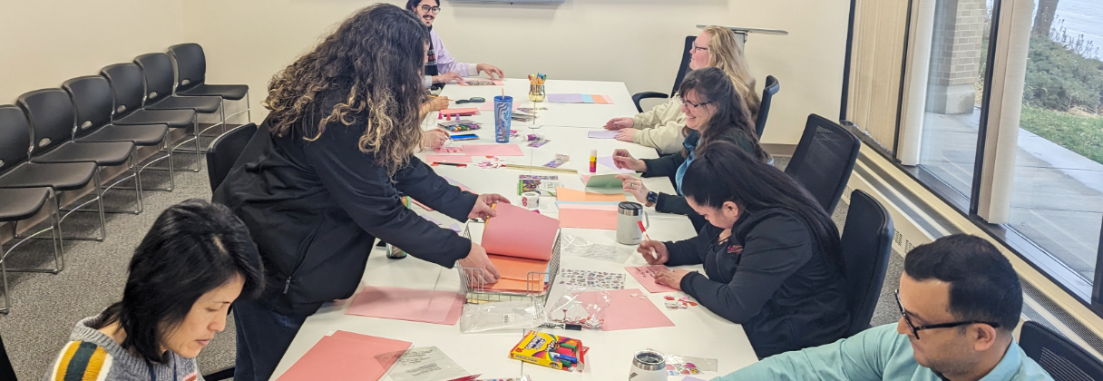 A group of people sitting around a table.