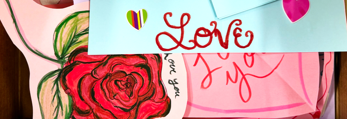 A card with a rose and a note.