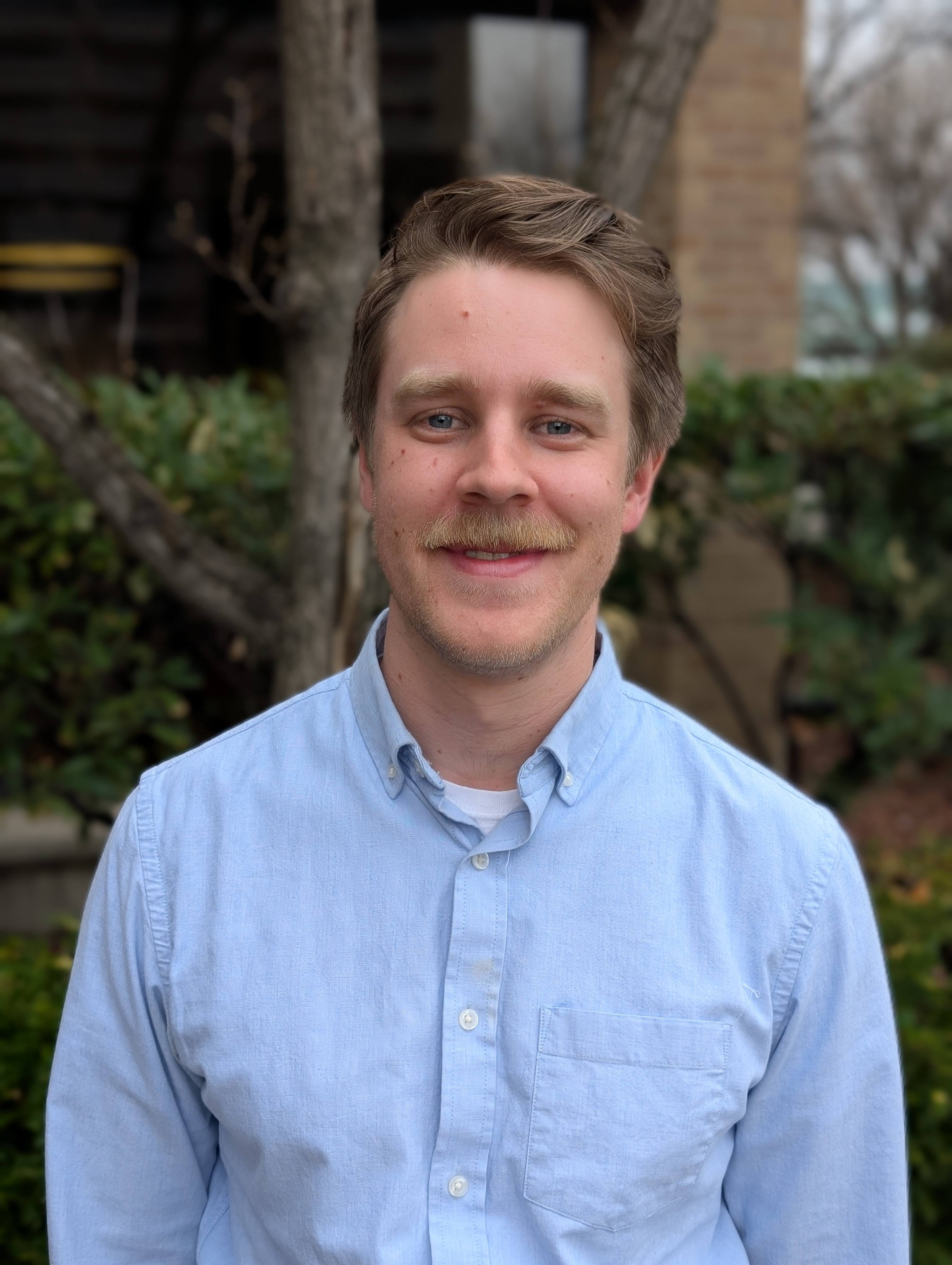 A man smiling for the camera.