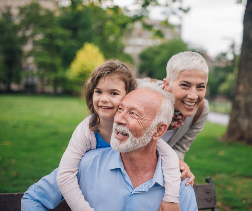 A group of people sitting on a bench.