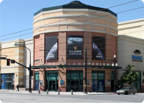 A building with a car parked in front of it.
