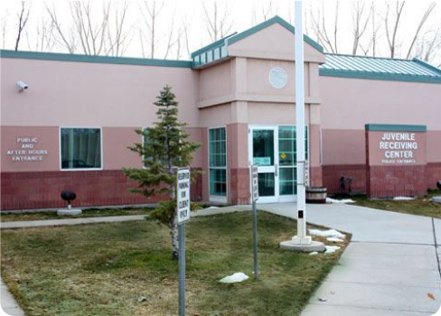 A building with a sign in front.