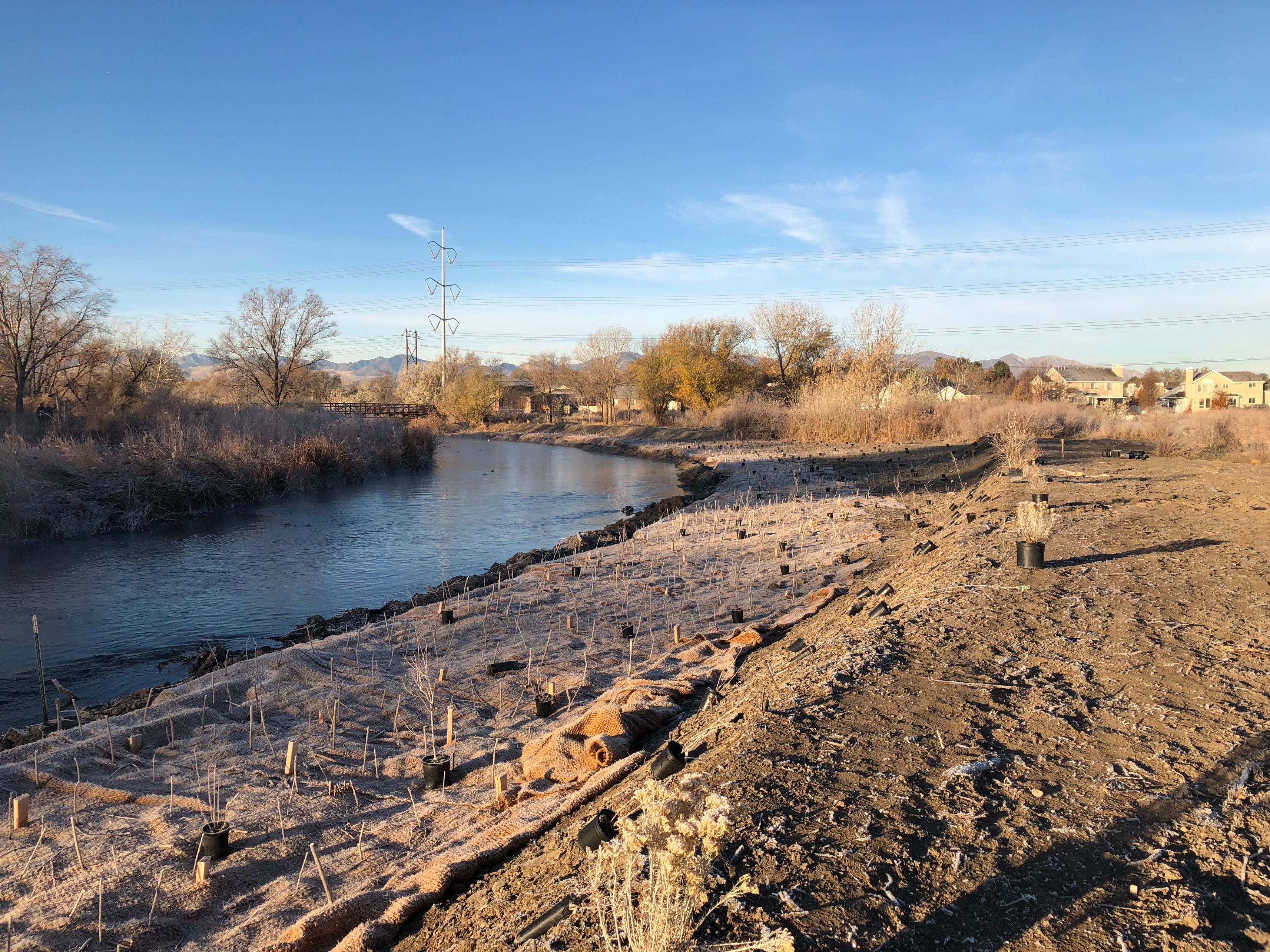 A river with a small bridge.