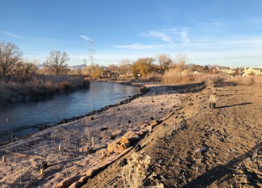 A river with a small bridge.