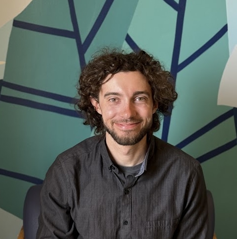 A man with curly hair.