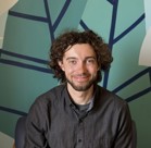 A man with curly hair.