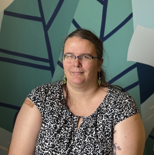 A woman wearing glasses.