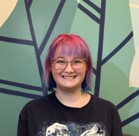 A woman with pink hair.