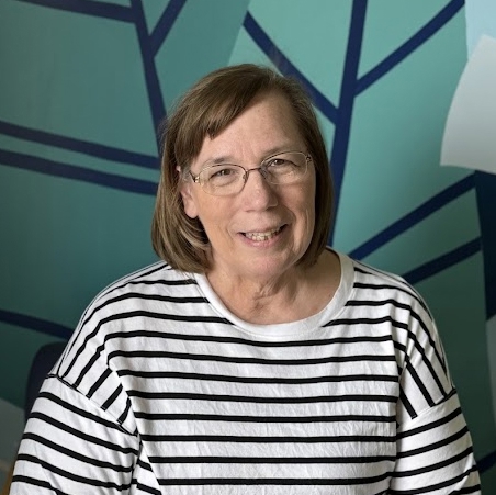 A woman wearing glasses.