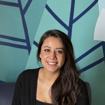 A woman smiling for the camera.