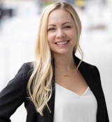 A woman smiling at the camera.