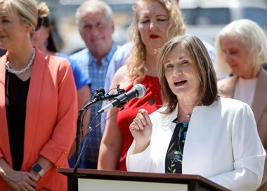 A person speaking into a microphone.