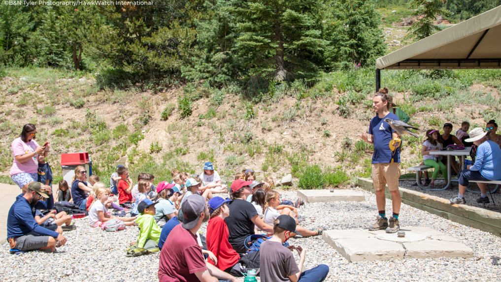 A man addressing a group of people.