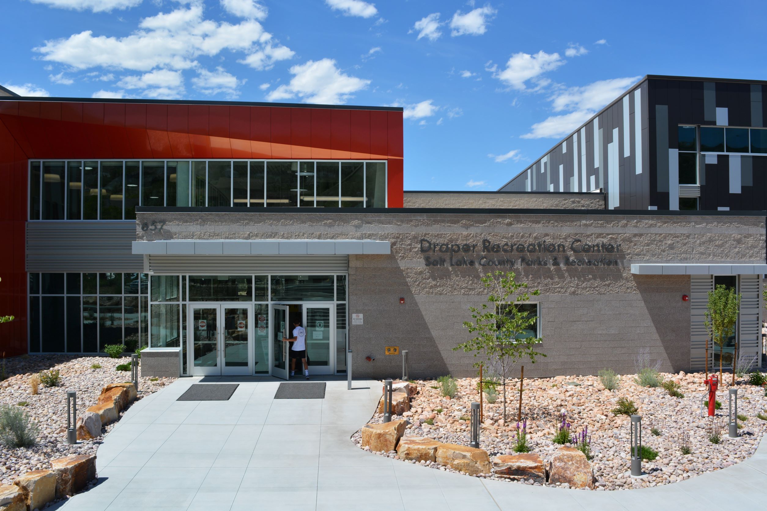 A building with a few people standing outside.