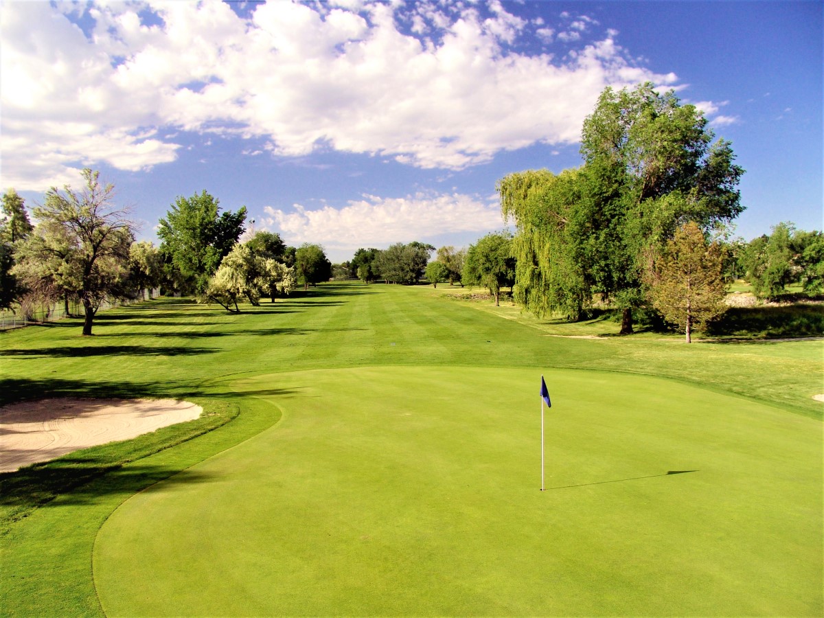 A golf course with a flag.