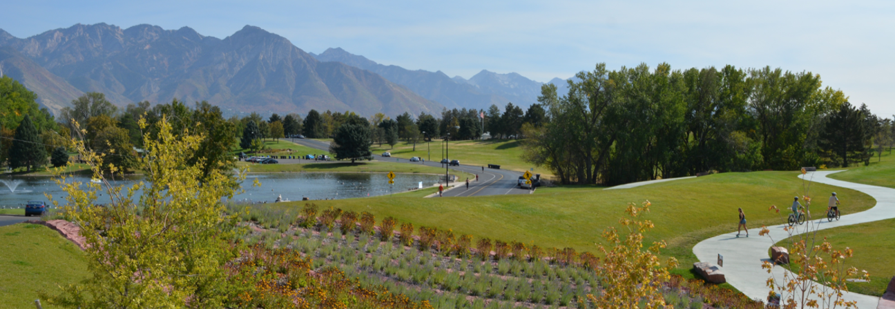 A golf course with a pond.