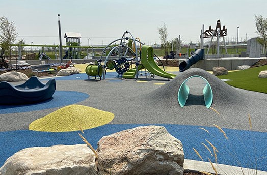 A skate park with a bike and rocks.